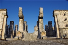 Chac-Mool flanked by feathered serpents faces the setting Zenith Sun. 